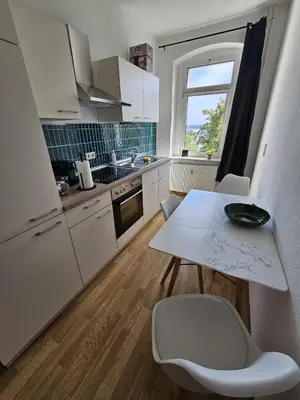 Küche/Küchenzeile in der Unterkunft Moderne Ferienwohnung in unmittelbarer Nähe zum Schloss