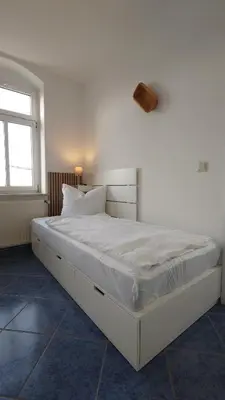 Ein Bett oder Betten in einem Zimmer der Unterkunft alte Bäckerei Ottendorf-Okrilla - #Lisa# im Norden von Dresden, WLan, Netfix