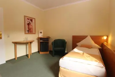 Ein Bett oder Betten in einem Zimmer der Unterkunft Rabenauer Mühle 