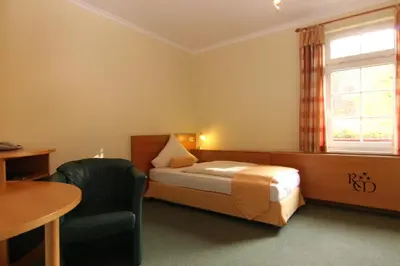 Ein Bett oder Betten in einem Zimmer der Unterkunft Rabenauer Mühle 