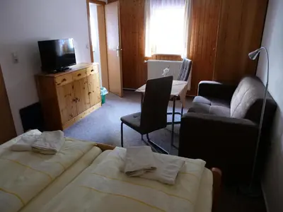 Ein Bett oder Betten in einem Zimmer der Unterkunft Erbgerichtsgasthof Holzhau