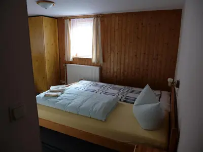 Ein Bett oder Betten in einem Zimmer der Unterkunft Erbgerichtsgasthof Holzhau