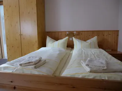 Ein Bett oder Betten in einem Zimmer der Unterkunft Erbgerichtsgasthof Holzhau