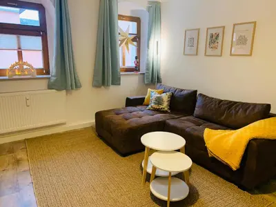 Ein Sitzbereich in der Unterkunft Am Schloss Wolkenstein, 86m2, 3BR, Babybett, Office