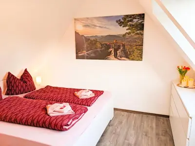 Ein Bett oder Betten in einem Zimmer der Unterkunft B7 - Urlaubsmagie Maisonette Wohnung mit Balkon