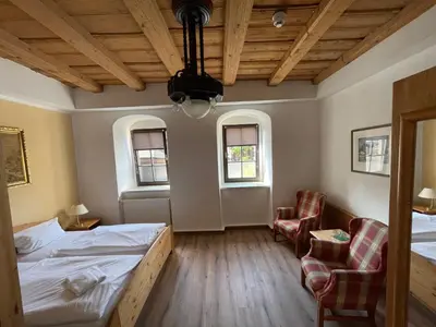 Ein Bett oder Betten in einem Zimmer der Unterkunft Braugut Hartmannsdorf