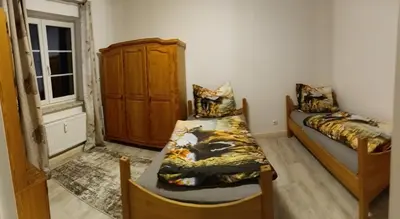 Ein Bett oder Betten in einem Zimmer der Unterkunft Ferienwohnung Finkenberg