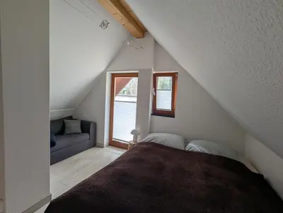 Ein Bett oder Betten in einem Zimmer der Unterkunft Kleines Ferienhaus Hoher Stein im Elbtal