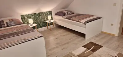 Ein Bett oder Betten in einem Zimmer der Unterkunft Schloßbergblick