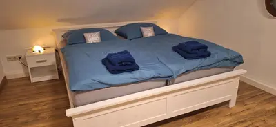 Ein Bett oder Betten in einem Zimmer der Unterkunft Schloßbergblick