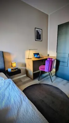 Ein Bett oder Betten in einem Zimmer der Unterkunft StayFine - smartes Design Apartment am Uni Campus