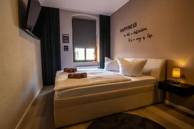 Ein Bett oder Betten in einem Zimmer der Unterkunft StayFine - smartes Design Apartment am Uni Campus