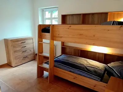Ein Bett oder Betten in einem Zimmer der Unterkunft Seyfarthrooms - Ferienwohnung Zum Dorfladen Rathen - zentrale Lage mit direkter Anbindung an das Wanderwegenetz, moderne Inneneinrichtung