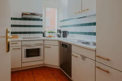 Küche/Küchenzeile in der Unterkunft Zentrumsnah, Balkon, 2 Smart TV, schnelles WiFi