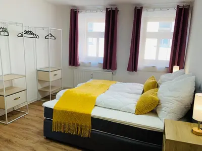Ein Bett oder Betten in einem Zimmer der Unterkunft Am Schloss Wolkenstein, 75m2, 2BR, Babybett