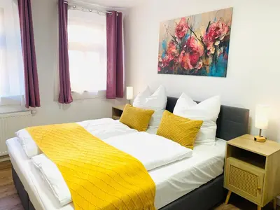 Ein Bett oder Betten in einem Zimmer der Unterkunft Am Schloss Wolkenstein, 75m2, 2BR, Babybett