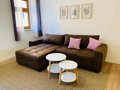 Ein Sitzbereich in der Unterkunft Am Schloss Wolkenstein, 75m2, 2BR, Babybett