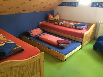 Ein Bett oder Betten in einem Zimmer der Unterkunft Ferienwohnung Casa Casimir mit Elbblick, Balkon und großen Garten