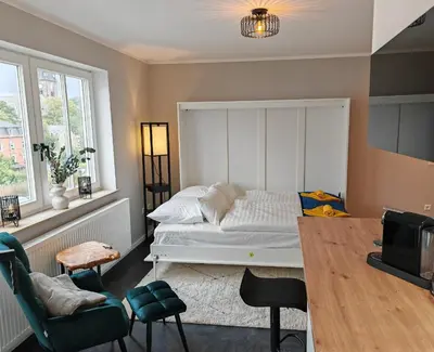 Ein Bett oder Betten in einem Zimmer der Unterkunft Sunnybelle Appartements Freital I