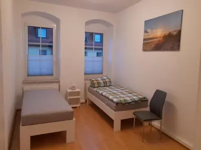 Ein Bett oder Betten in einem Zimmer der Unterkunft Monteurswohnung Place2Stay