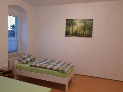 Ein Bett oder Betten in einem Zimmer der Unterkunft Monteurswohnung Place2Stay