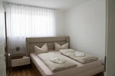 Ein Bett oder Betten in einem Zimmer der Unterkunft KoschenOase Wohnung barreriefrei 4 Personen