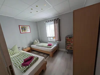 Ein Bett oder Betten in einem Zimmer der Unterkunft Pension Remenar & Lorenz