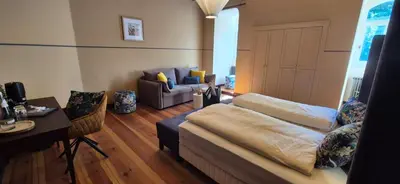 Ein Bett oder Betten in einem Zimmer der Unterkunft Schlosshotel Hohenbocka
