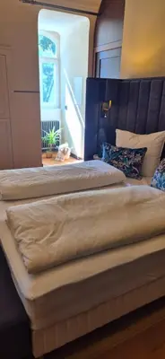 Ein Bett oder Betten in einem Zimmer der Unterkunft Schlosshotel Hohenbocka