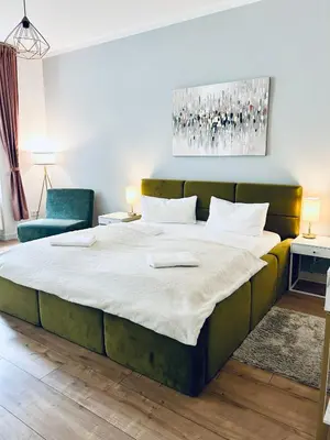 Ein Bett oder Betten in einem Zimmer der Unterkunft Modernes City-Apartment mit großer Terrasse