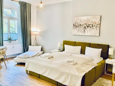 Ein Bett oder Betten in einem Zimmer der Unterkunft Modernes City-Apartment mit großer Terrasse