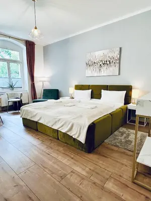 Ein Bett oder Betten in einem Zimmer der Unterkunft Modernes City-Apartment mit großer Terrasse