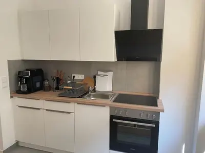 Küche/Küchenzeile in der Unterkunft Modernes City-Apartment mit großer Terrasse