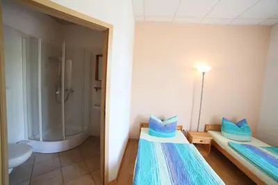 Ein Bett oder Betten in einem Zimmer der Unterkunft Gästehaus am schmalen See UG haftungsbeschränkt