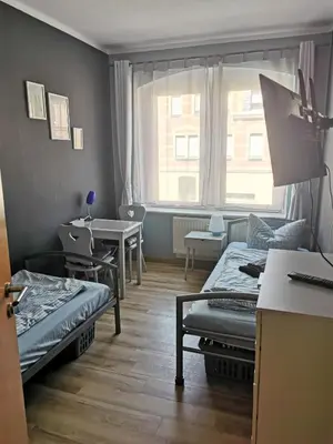 Ein Bett oder Betten in einem Zimmer der Unterkunft SaxonyBNB