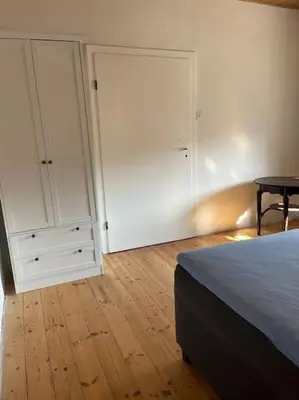 Ein Bett oder Betten in einem Zimmer der Unterkunft Rosa Schwarz