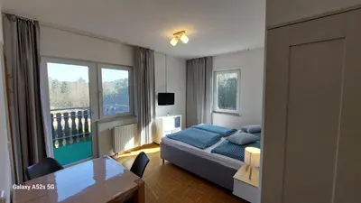 Ein Bett oder Betten in einem Zimmer der Unterkunft Gästehaus Bergwald