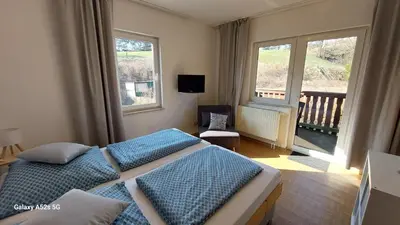 Ein Bett oder Betten in einem Zimmer der Unterkunft Gästehaus Bergwald