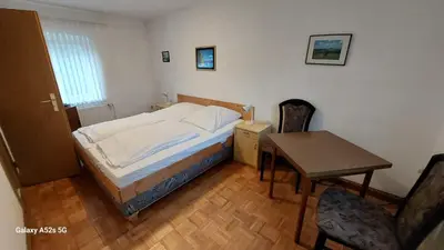 Ein Bett oder Betten in einem Zimmer der Unterkunft Gästehaus Bergwald