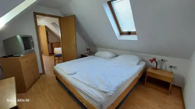 Ein Bett oder Betten in einem Zimmer der Unterkunft Gästehaus Bergwald