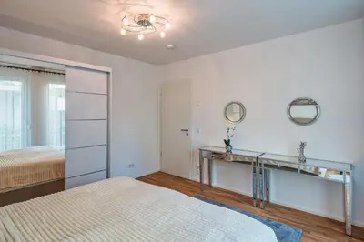 Ein Bett oder Betten in einem Zimmer der Unterkunft Apartment am Großen Garten - Terrasse & Parkplatz -8 Personen