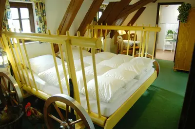 Ein Bett oder Betten in einem Zimmer der Unterkunft Landhaus Sorgenfrei