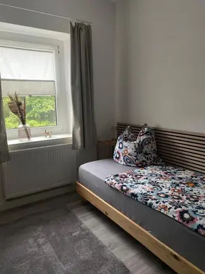 Ein Bett oder Betten in einem Zimmer der Unterkunft Pension Gut Runge