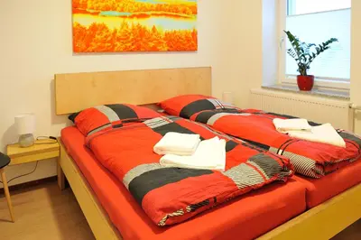 Ein Bett oder Betten in einem Zimmer der Unterkunft Lausitzer Ferienapartment Suite