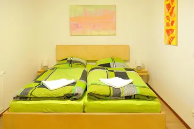 Ein Bett oder Betten in einem Zimmer der Unterkunft Lausitzer Ferienapartment Suite