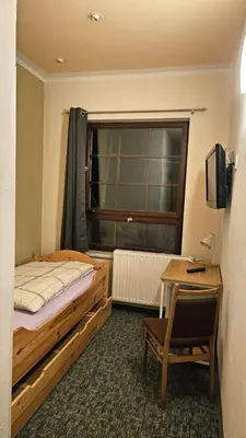 Ein Bett oder Betten in einem Zimmer der Unterkunft Burgblick