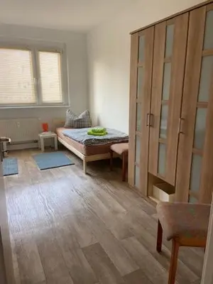 Ein Bett oder Betten in einem Zimmer der Unterkunft Monteurswohnungen Krämer