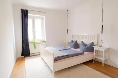 Ein Bett oder Betten in einem Zimmer der Unterkunft Ruhige Wohnung auf dem Sonnenstein