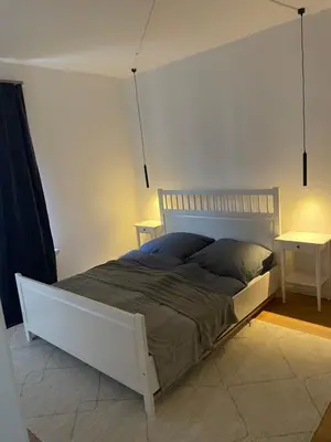 Ein Bett oder Betten in einem Zimmer der Unterkunft Ruhige Wohnung auf dem Sonnenstein