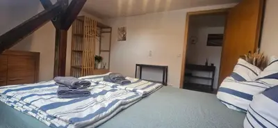 Ein Bett oder Betten in einem Zimmer der Unterkunft FeWo Wittig am Kulturbahnhof 2